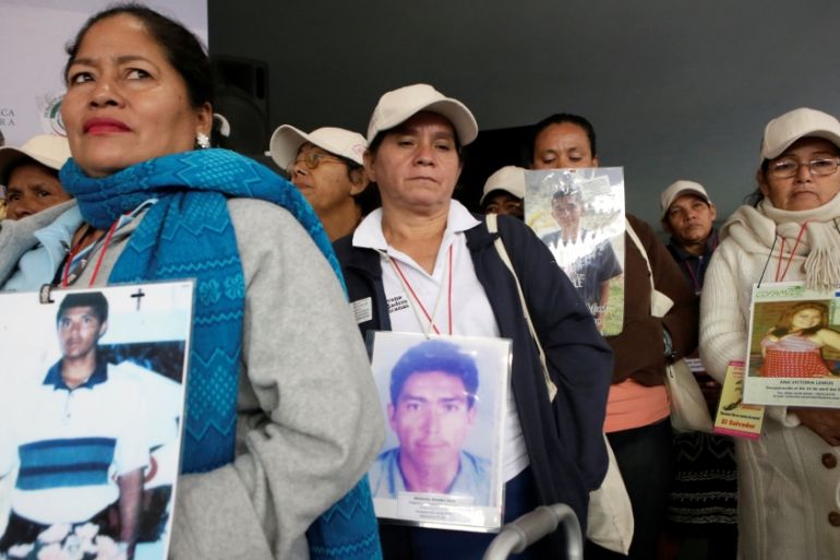 Caravan of Central American migrants'' mothers hold pictures of relatives in Mexico City