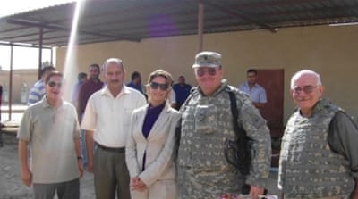 Farah, centre, with members of her team and US forces in Iraq in 2007 [Photo courtesy of Farah Marcolla]