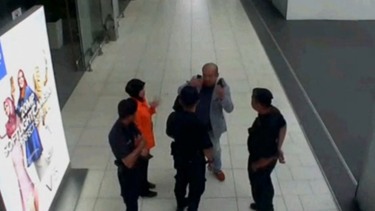 Video grab appears to show a man purported to be Kim Jong Nam talking to security personnel, after being accosted by a woman in a white shirt, at Kuala Lumpur International Airport in Malaysia