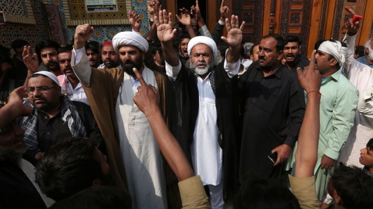 Men and local religious leaders chant slogans as they protest to condemn Thursday''s suicide blast at the tomb of Sufi saint Syed Usman Marwandi, also known as the Lal Shahbaz Qalandar shrine
