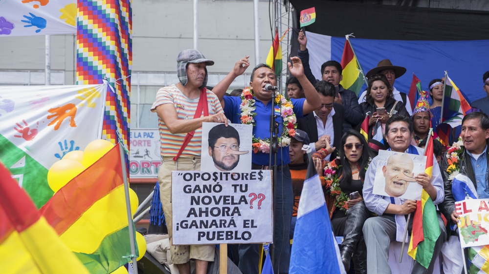 Juan Torrejon, a regional president for Evo Morales's ruling party MAS, speaks to a crowd of people who are in favour of the Bolivian president's re-election [Eline van Nes/Al Jazeera]