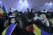 Two women shout slogans during a protest against the Romanian government in Piata Victoriei, Bucharest on February 6 [EPA]