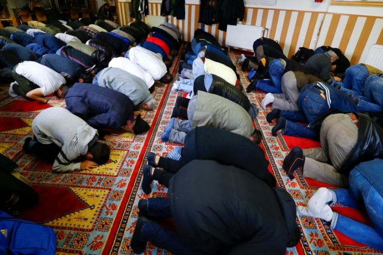 Muslims pray during Friday prayers at the Turkish Kuba Camii mosque located near a hotel housing refugees in Cologne''s district of Kalk