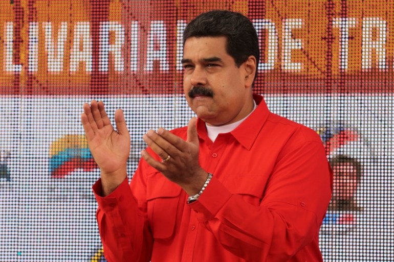 Venezuela''s President Nicolas Maduro applauds as he attends a pro-government rally with workers in Caracas