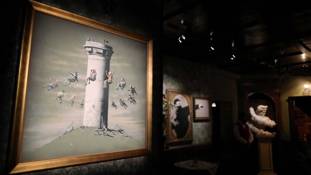  Banksy's artwork comments on war, child poverty and the environment [Reuters]