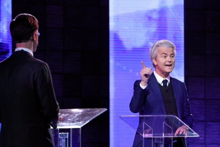 Dutch far-right politician Geert Wilders of the PVV party and Dutch Prime Minister Mark Rutte of the VVD Liberal party take part in the "EenVandaag" debate in Rotterdam