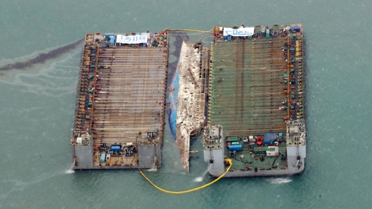 The sunken ferry Sewol is seen during its salvage operations at the sea off Jindo