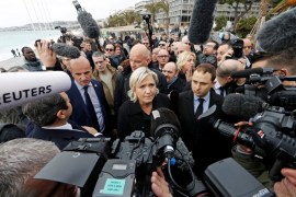 French National Front leader Marine Le Pen and presidential election candidate talks to the media on the Promenade des Anglais in Nice