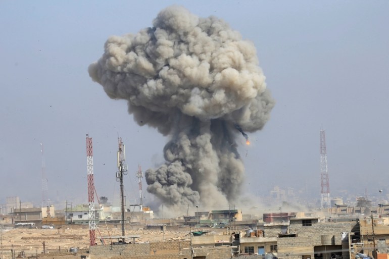 Cloud of smoke rises after an airstrike, during the battle against Islamic State militants, at the district of al-Mamoun in Mosul