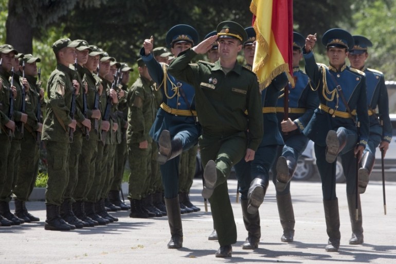 Servicemen of the military forces of South Ossetia march during an oath of allegiance ceremony in Tskhinvali