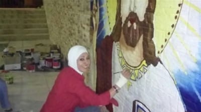 'The temperature was below zero when I painted this, but I was determined to convey a message that ISIS can't turn us against one another' [Al Jazeera]