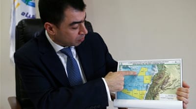 Cesar Abou Khalil shows a map of Lebanon with sea blocks for oil and gas licensing [Mohamed Azakir/Reuters]