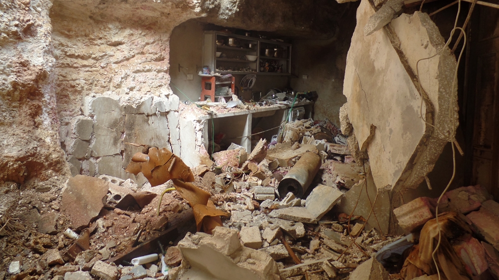 This is what's left of the Taleb family's home after a chlorine canister fell on it on March 16, 2015 [Courtesy of Sarmin field hospital/Al Jazeera]