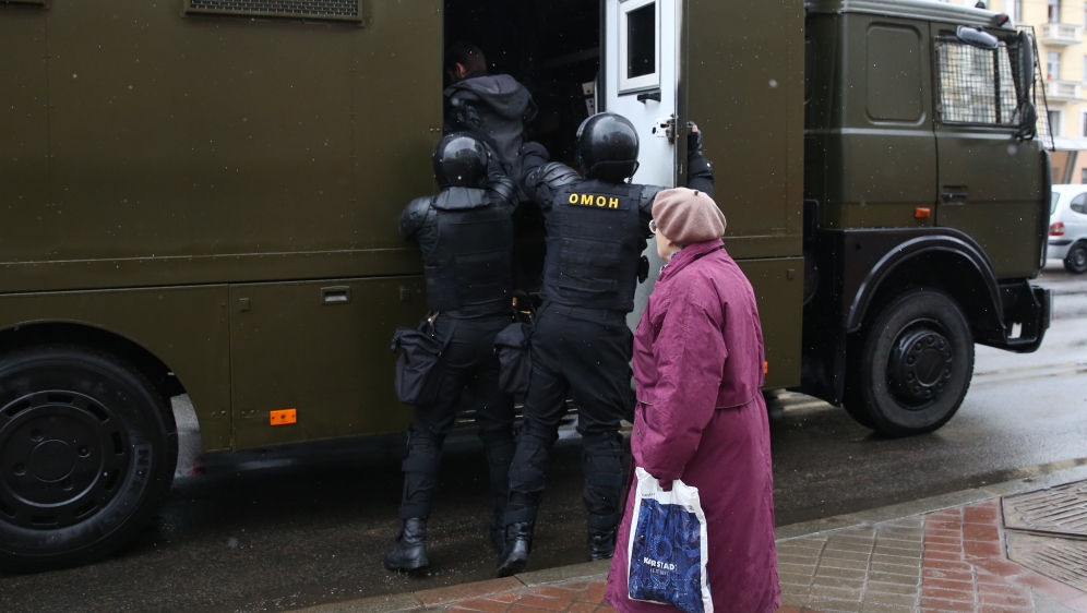 Police officers detain a protester during a rally in Minsk on 25 March [EPA/Tatyana Zenkovich] 