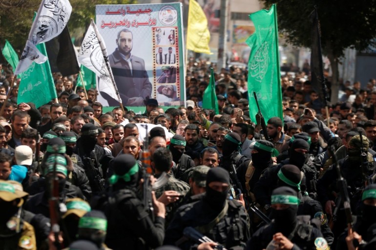 Palestinian members of Hamas'' armed wing take part in the funeral of senior militant Mazen Fuqaha