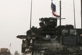 FILE PHOTO: U.S. army vehicles drive north of Manbij city