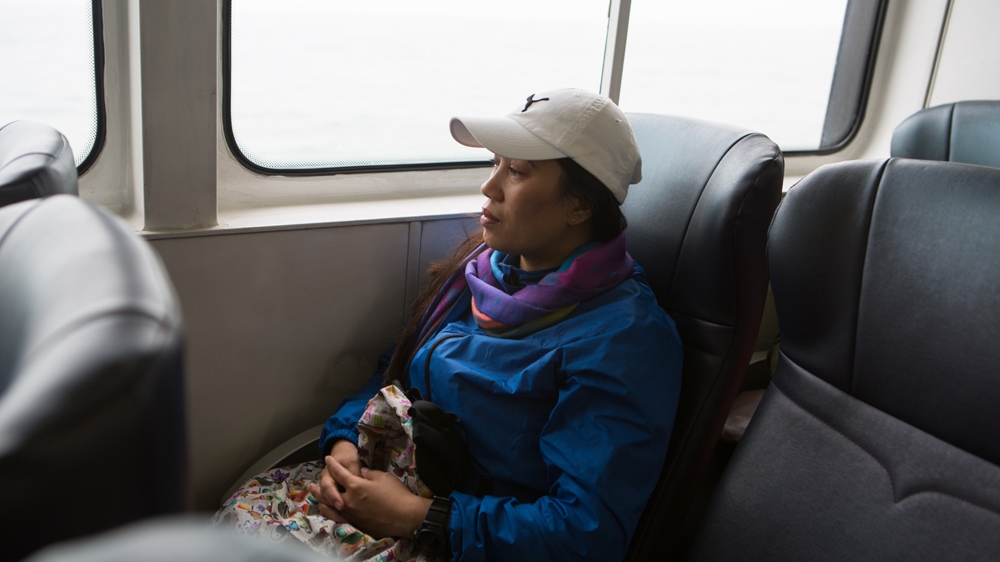 While her daughter Keana is in school, Rodel frequently takes ferries between the various island territories of Hong Kong [Maria de la Guardia/Al Jazeera] 