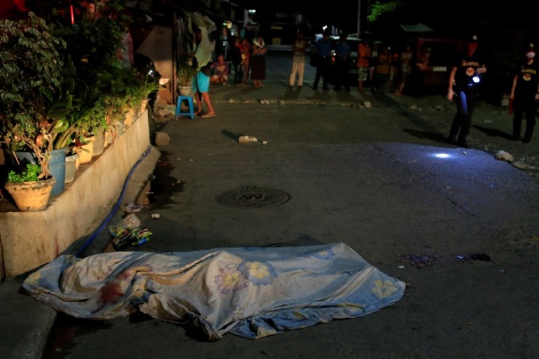 The body of a suspected drug pusher in the Philippines