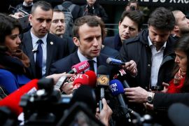 Emmanuel Macron, head of the political movement En Marche !, or Onwards !, and candidate for the 2017 presidential election, speaks with journalists as he leaves a police station in Paris