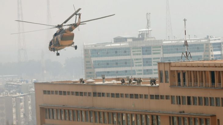 Afghan National Army (ANA) soldiers descend from helicopter on a roof of a military hospital during gunfire and blast in Kabul, Afghanistan