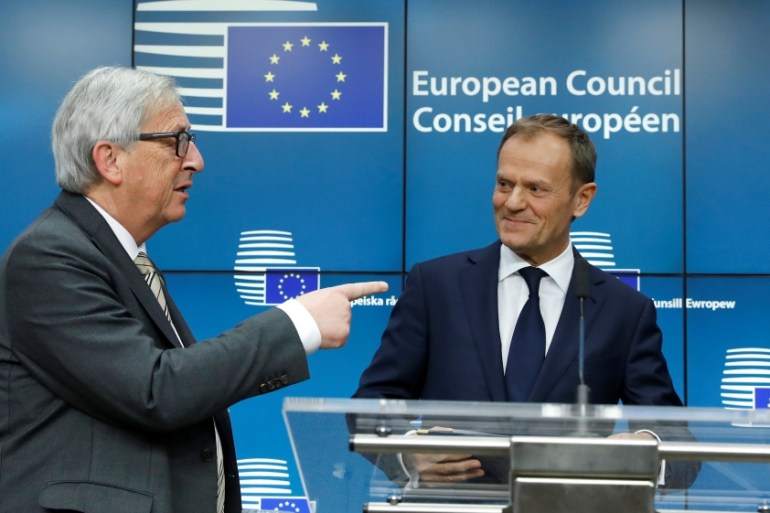 EU Commission President Juncker and European Council President Tusk take part in a news conference after being reappointed chairman of the European Council during a EU summit in Brussels