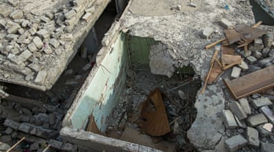 Khalaf's neighbour's home was partially destroyed by the air strike  [Joao Castellano/Al Jazeera] 