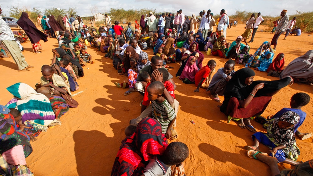 This photo from 2011 shows refugees who had fled the famine-hit Somalia waiting in line at a reception at Ifo camp, one of three camps that make up sprawling Dadaab refugee camp in Dadaab, northeastern Kenya [File: Dai Kurokawa/EPA]