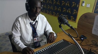 'Since I started working at this station in 2008, nine of my colleagues left. Some went abroad to get away from Jammeh and others left journalism,' says radio presenter Biram Sait Jobe [Hamza Mohamed/Al Jazeera]