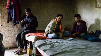 From left to right, Imran Ahmed, Adnan Ahmed and Faisal Razza in their house on the edge of Poullakida [Will Horner/Al Jazeera]