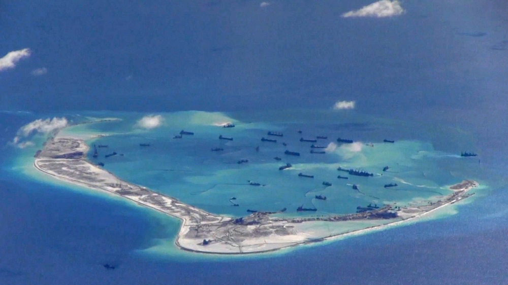 Latest reports say China has nearly completed construction on three man-made islands in the disputed area of South China Sea [Reuters]
