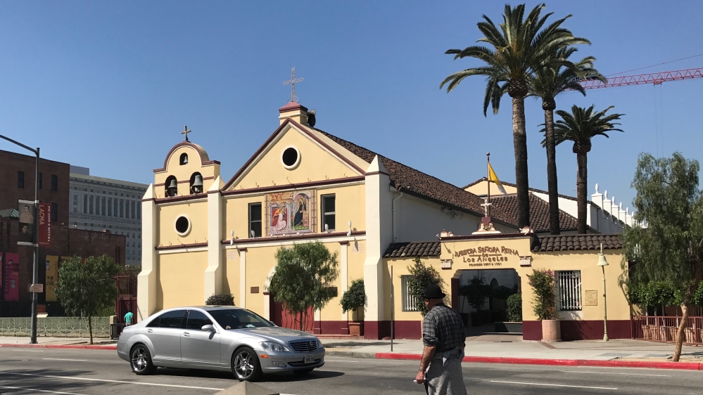Father Arturo Corral spoke to Al Jazeera at Los Angeles' historic Our Lady Queen of Angels church. [Massoud Hayoun/Al Jazeera]