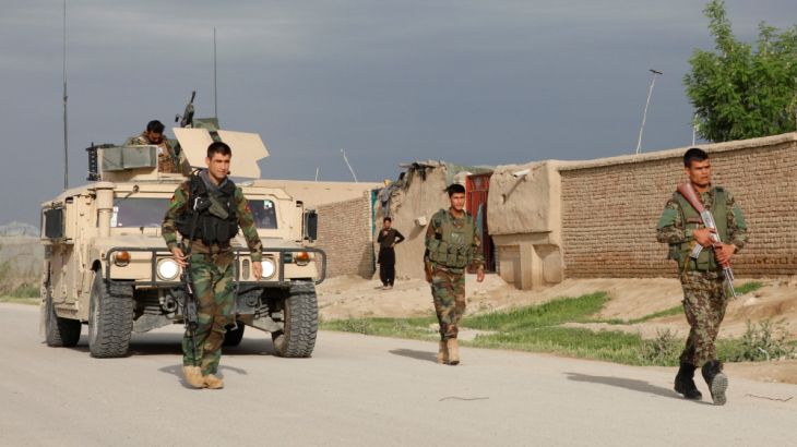 Afghan national Army (ANA) troops arrive near the site of an ongoing attack on an army headquarters in Mazar-i-Sharif northern Afghanistan
