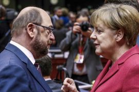 SDP leader and former European Parliament President Martin Schulz (L) and German Chancellor Angela Merkel (R)