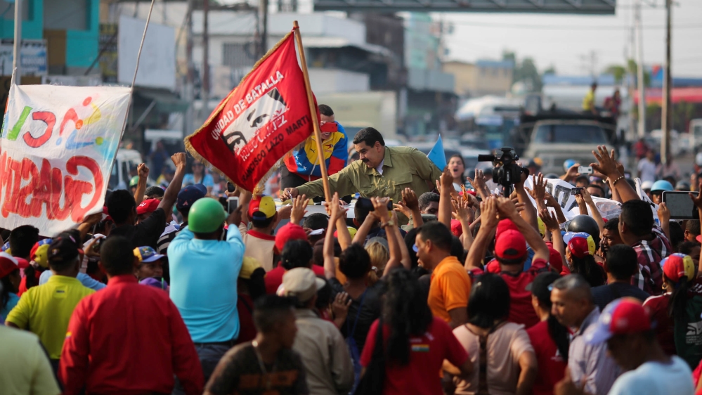 Maduro greeted supporters during a meeting in Biruaca on Tuesday [Miraflores Palace/Handout via Reuters]