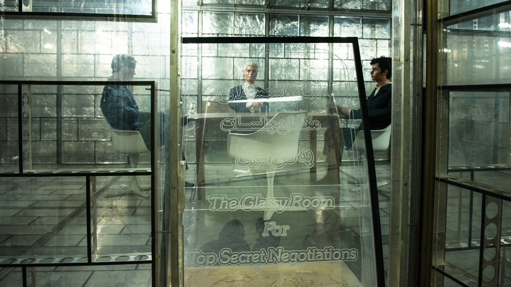 'The Glassy Room for Top-Secret Negotiations' is an exhibit erected in a former venue for confidential negotiations [Wojtek Arciszewski/Al Jazeera] 