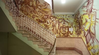These decorated stairs lead up to the exhibits on the second floor of the embassy museum [Wojtek Arciszewski/Al Jazeera]