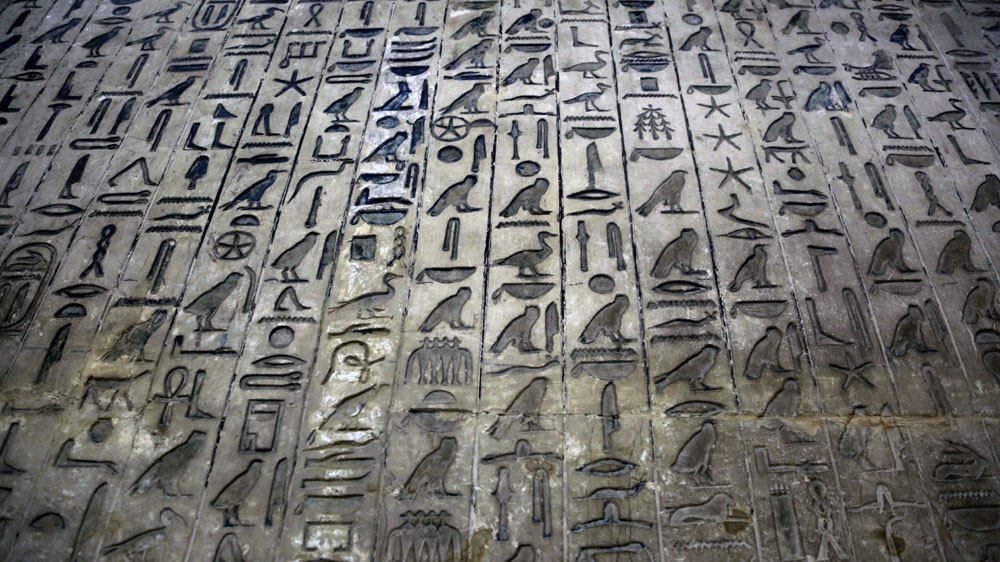 Inside Saqqara's crumbled pyramid of Unis, hieroglyphs and archaic pyramid texts are inscribed along its walls [Dorian Geiger/Al Jazeera]
