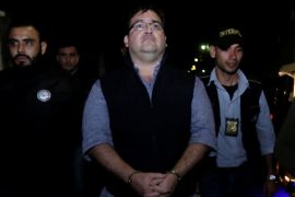 Former governor of Mexican state Veracruz Javier Duarte is escorted by authorities after he was detained in a hotel in Panajachel