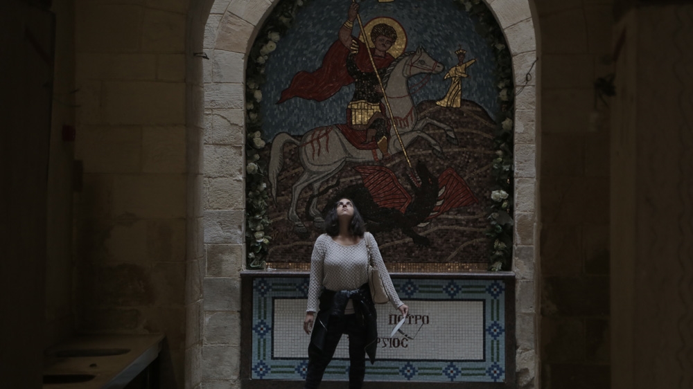 A mosaic of St. George slaying a dragon at a Coptic church in Old Cairo [Dorian Geiger/Al Jazeera]