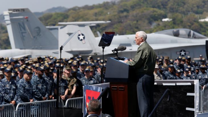 US Vice President Mike Pence delivers a speech to U.S. and Japanese service members on the flight deck of USS Ronald Reagan