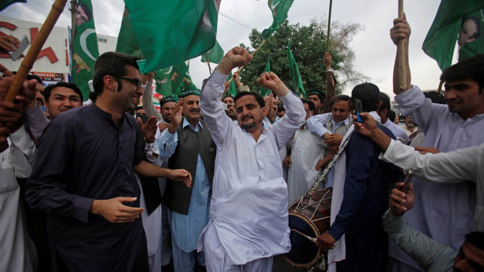 Supporters of Nawaz Sharif celebrate following the Supreme Court's decision [Reuters]