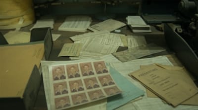 Decades-old documents and photos, some of which were believed to have been used to make IDs, still rest on the shelves [Wojtek Arciszewski/Al Jazeera]