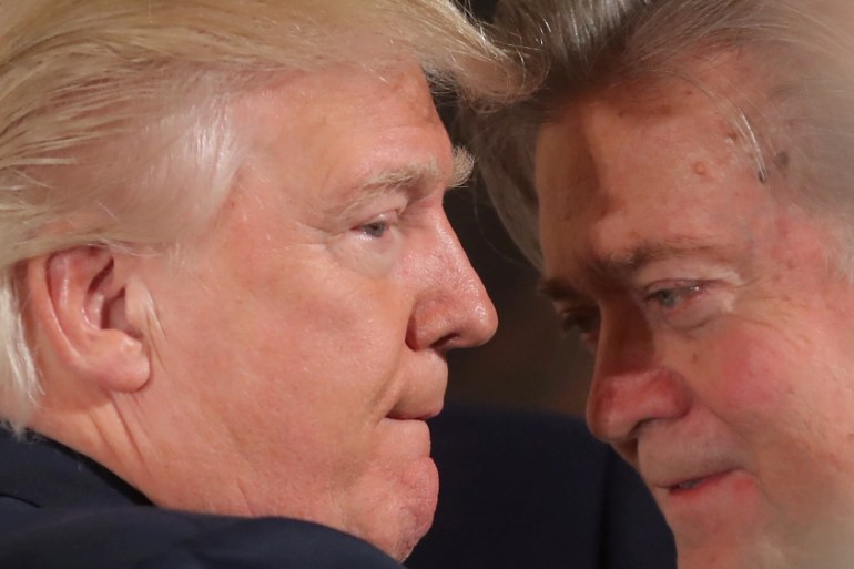 FILE PHOTO: U.S. President Donald Trump talks to senior staff Steve Bannon during a swearing in ceremony for senior staff at the White House in Washington, DC