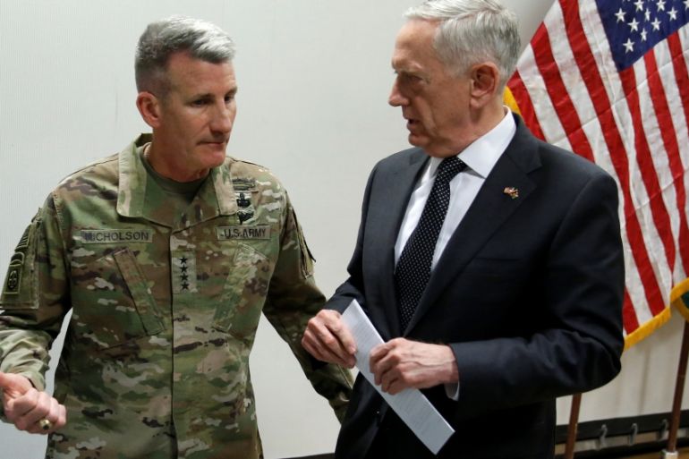 Mattis chats with Nicholson after a news conference at Resolute Support headquarters in Kabul