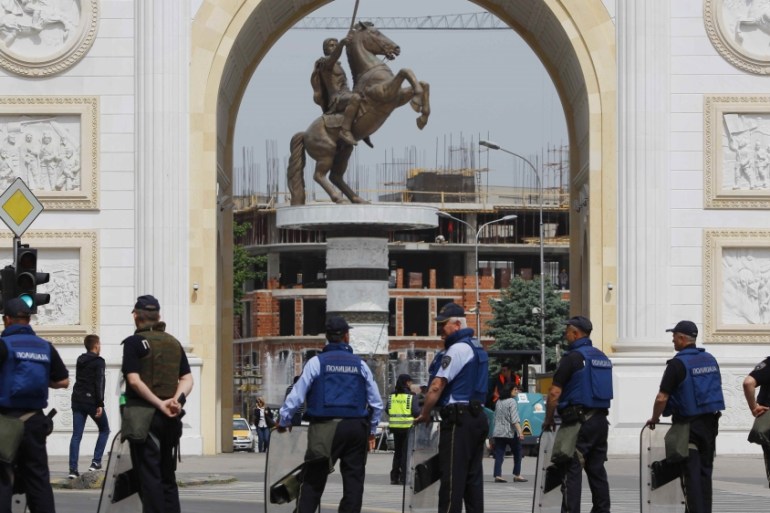 Macedonian police stand guard near the parliament building in Skopje