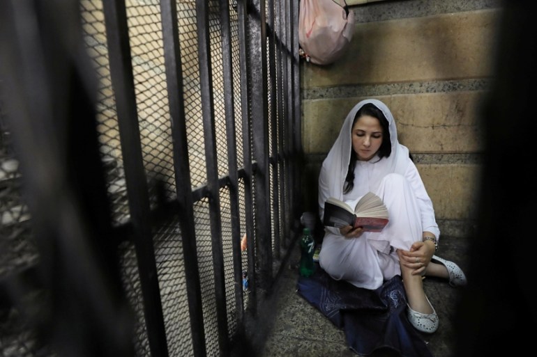 Aya Hijazi, founder of a non-governmental organisation that looks after street children, reading in prison