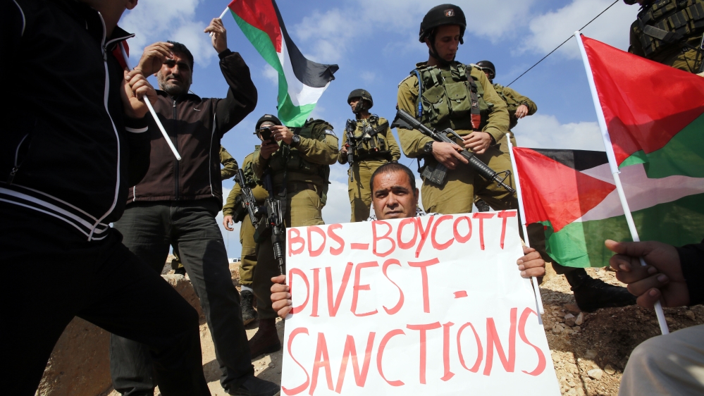 The BDS movement advocates non-violent economic means to pressure Israel into stopping violations against Palestinians [Abed Al Hashlamoun/EPA]