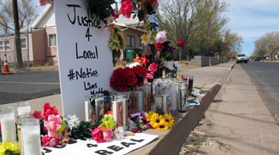 On April 5, 2016, candles, flowers and stuffed animals mark the site where Loreal Tsingine was shot and killed by Winslow, Arizona, police officer Austin Shipley on March 27 [AP Photo/Felicia Fonseca]