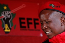 Julius Malema, the firebrand leader of South Africa's Economic Freedom Fighters (EFF) looks on before addressing his supporters during his campaign, ahead of the August 3 local government elections