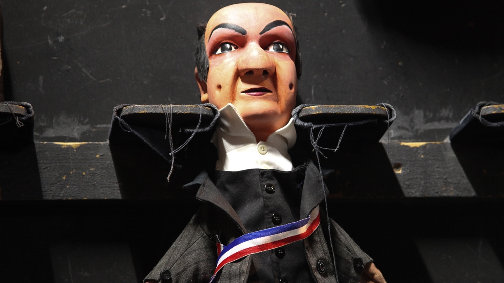 Even in the theatre's everyday performances, there is a political component. During a children's show, this puppet stood in for the President of France, a character so elitist he worried the poor would dirty his shoes. [Allison Griner/Al Jazeera]